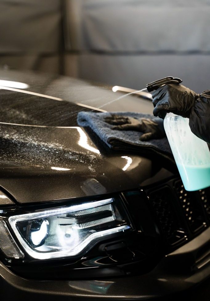 Cleaning car using microfiber and quick detailer